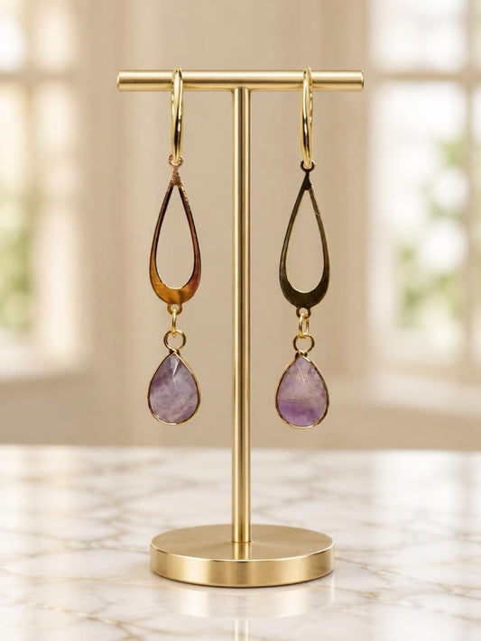 Amethyst Elegance – 18K Gold-Plated Teardrop EarringsElegant, feminine, and timeless.Add a touch of sophistication to your jewelry collection with these beautiful Amethyst Teardrop Earrings. Featuring delicate open teardrop designs in 18K gold-plated meta
