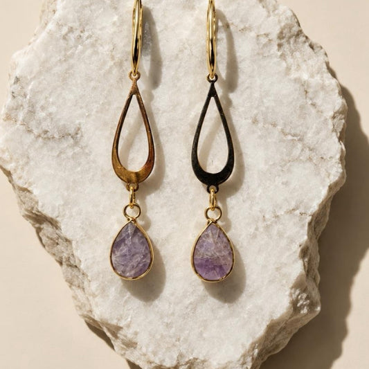 Amethyst Elegance – 18K Gold-Plated Teardrop EarringsElegant, feminine, and timeless.Add a touch of sophistication to your jewelry collection with these beautiful Amethyst Teardrop Earrings. Featuring delicate open teardrop designs in 18K gold-plated meta